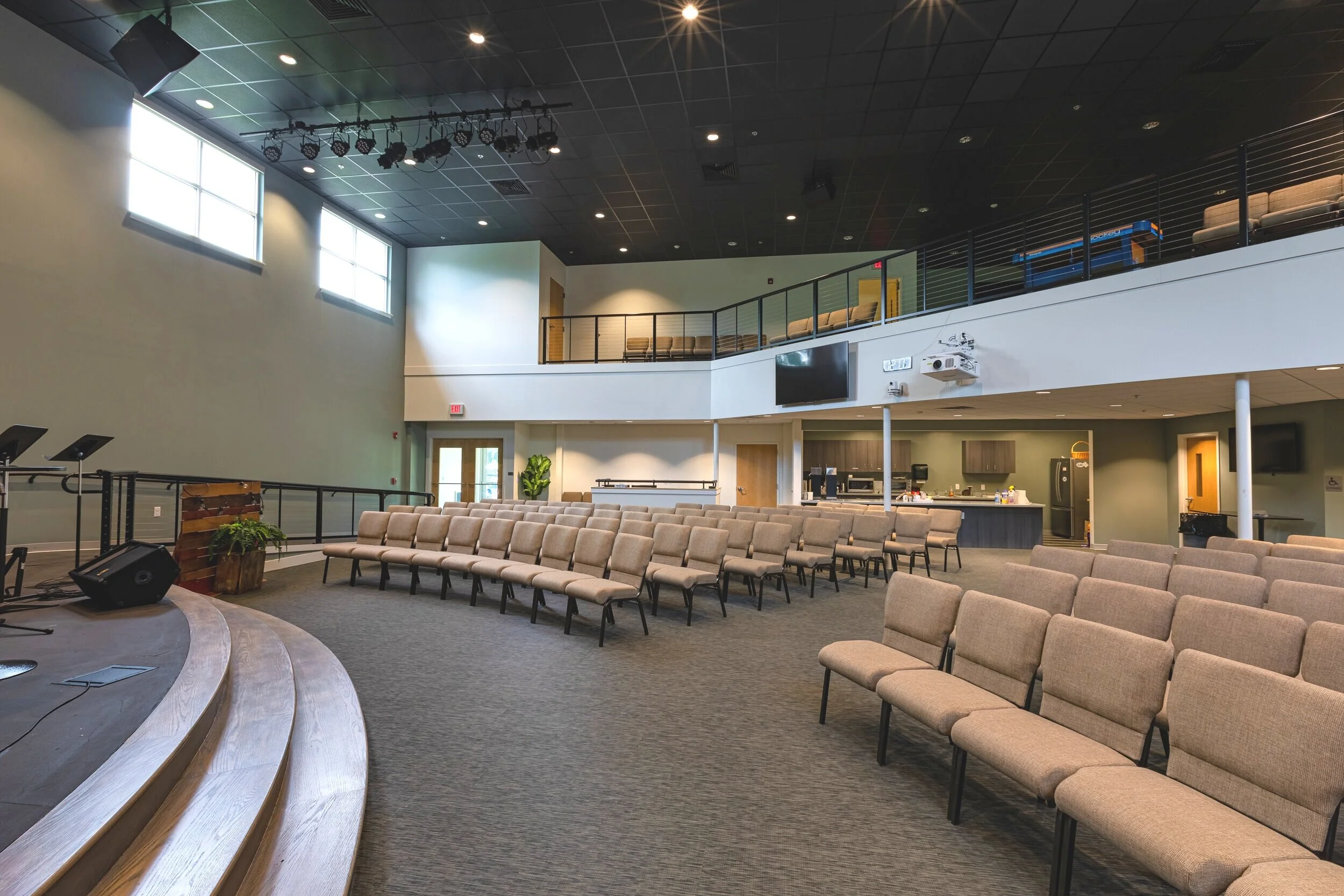 Professional cleaner in blue uniform cleaning church carpet